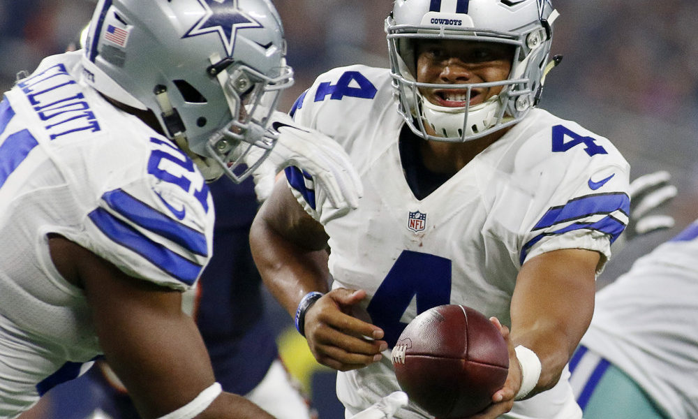 25 SEP 2016: Dallas Cowboys Quarterback Dak Prescott (4) [20763] hands off to Dallas Cowboys Running Back Ezekiel Elliott (21) [21194] during a NFL game between the Chicago Bears and the Dallas Cowboys at AT&T Stadium in Arlington, TX. (Photo by Ray Carlin/Icon Sportswire)