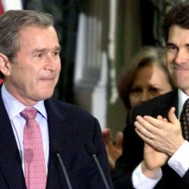 A teary-eyed President-elect George W. Bush (L) listens to applause after formally resigning as gove..