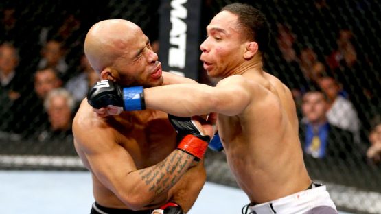 061714-UFC-John-Dodson-punches-Demetrious-Johnson-PI.vresize.1200.675.high.58