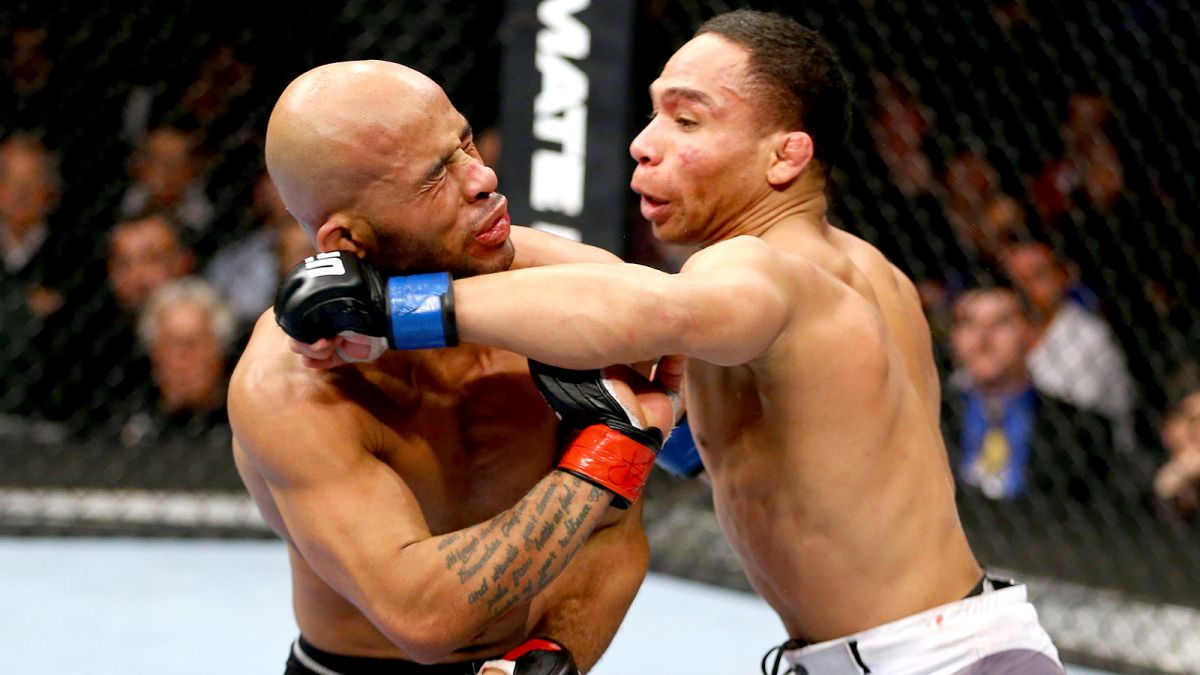 061714-UFC-John-Dodson-punches-Demetrious-Johnson-PI.vresize.1200.675.high.58