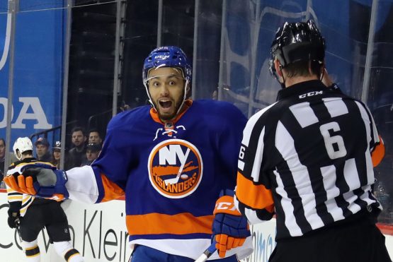 NEW YORK, NY - MARCH 25: Joshua Ho-Sang #66 of the New York Islanders argues a high sticking penalty against the Boston Bruins with referee Francis Charron #6 at the Barclays Center on March 25, 2017 in the Brooklyn borough of New York City. (Photo by Bruce Bennett/Getty Images)