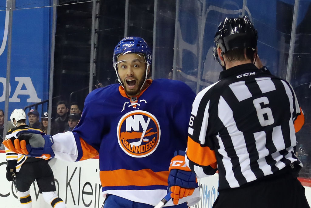 NEW YORK, NY - MARCH 25: Joshua Ho-Sang #66 of the New York Islanders argues a high sticking penalty against the Boston Bruins with referee Francis Charron #6 at the Barclays Center on March 25, 2017 in the Brooklyn borough of New York City. (Photo by Bruce Bennett/Getty Images)