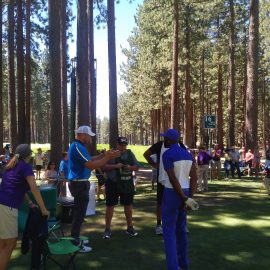 Former NFL stars Jerry Rice and Brian Urlacher waiting their turn at the 16th tee