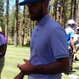 JT about to pull out a little girl from the gallery unexpectedly for a photo at the 16th tee