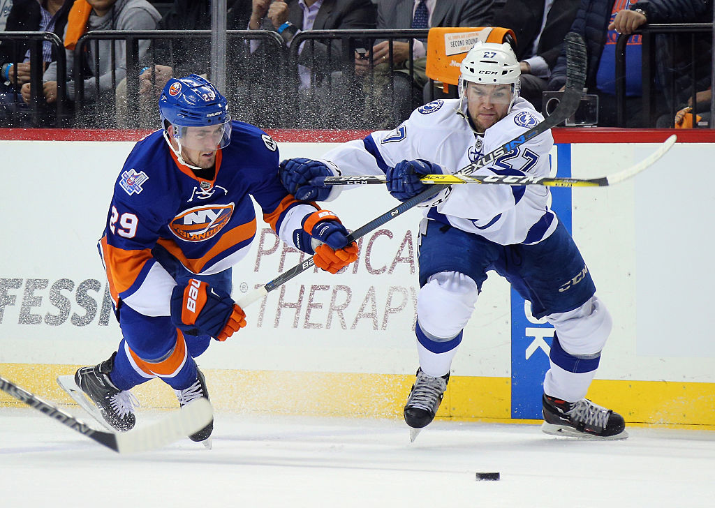 NEW YORK, NY - MAY 03: Brock Nelson #29 of the New York Islanders and Jonathan Drouin #27 of the Tampa Bay Lightning battle for the puck during the first period in Game Three of the Eastern Conference Second Round during the 2016 NHL Stanley Cup Playoffs at the Barclays Center on May 03, 2016 in the Brooklyn borough of New York City. (Photo by Bruce Bennett/Getty Images)