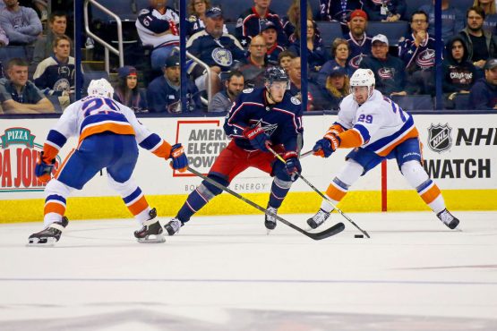 COLUMBUS, OH - OCTOBER 6: Pierre-Luc Dubois #18 of the Columbus Blue Jackets attempts to skate the puck past Jason Chimera #25 of the New York Islanders and Brock Nelson #29 of the New York Islanders during the third period on October 6, 2017 at Nationwide Arena in Columbus, Ohio. Columbus defeated New York 5-0. (Photo by Kirk Irwin/Getty Images)