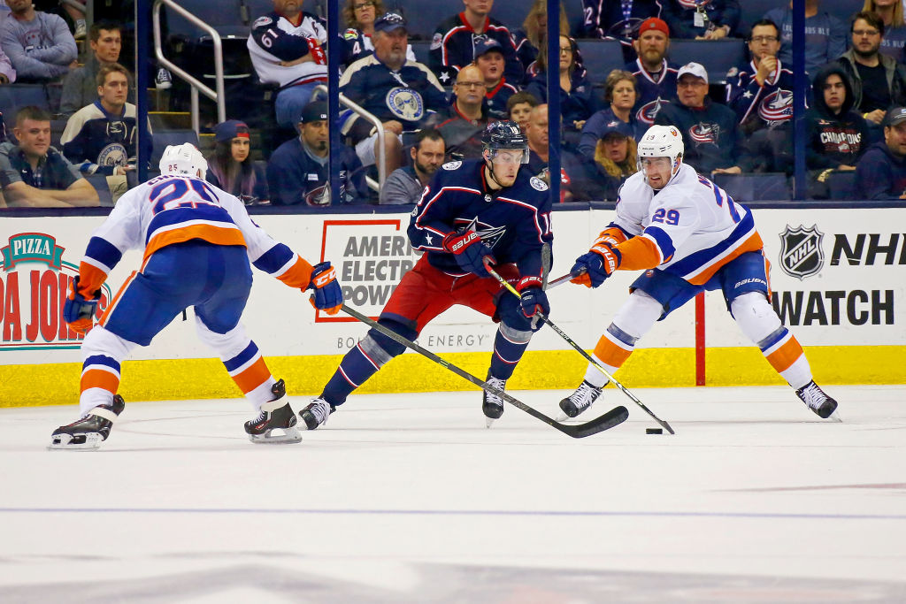 COLUMBUS, OH - OCTOBER 6: Pierre-Luc Dubois #18 of the Columbus Blue Jackets attempts to skate the puck past Jason Chimera #25 of the New York Islanders and Brock Nelson #29 of the New York Islanders during the third period on October 6, 2017 at Nationwide Arena in Columbus, Ohio. Columbus defeated New York 5-0. (Photo by Kirk Irwin/Getty Images)