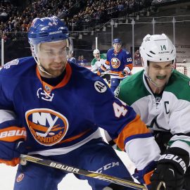 NEW YORK, NY - JANUARY 03: Calvin de Haan #44 of the New York Islanders fends off Jamie Benn #14 of the Dallas Stars skates against the New York Islanders at the Barclays Center on January 3, 2016 in the Brooklyn borough of New York City. The Islanders defeated the Stars 6-5. (Photo by Bruce Bennett/Getty Images)