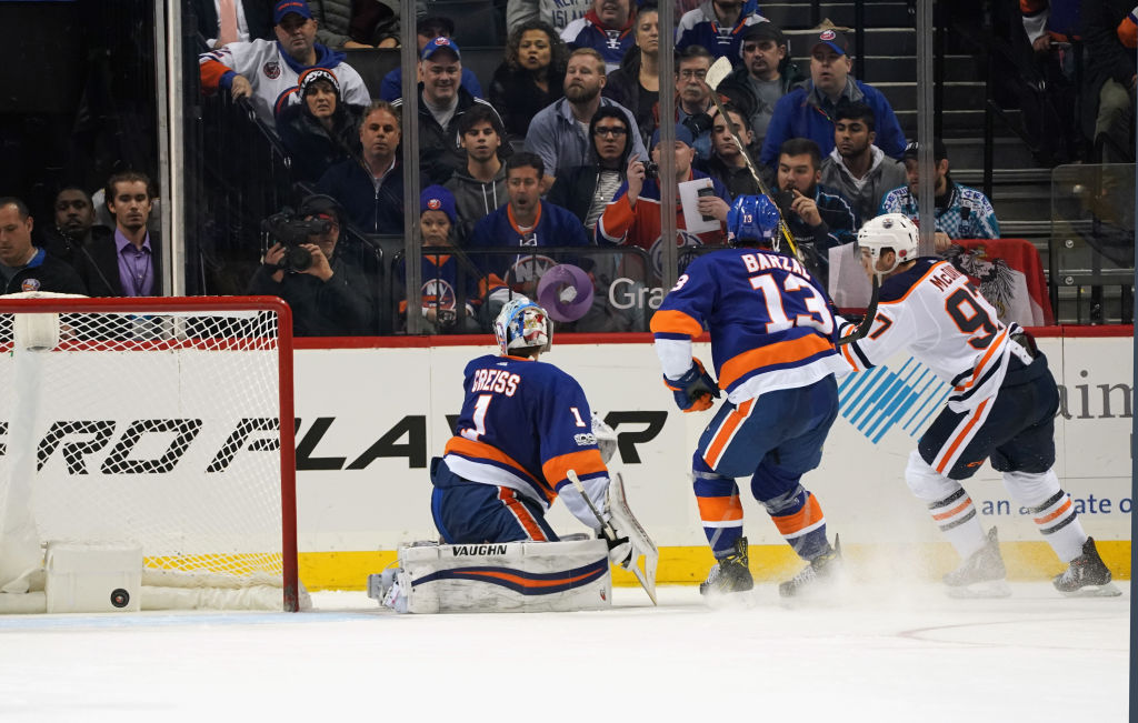 NEW YORK, NY - NOVEMBER 07: Connor McDavid #97 of the Edmonton Oilers celebrates his game winning overtime goal against Thomas Greiss #1 of the New York Islanders at the Barclays Center on November 7, 2017 in the Brooklyn borough of New York City. The Oilers defeated the Islanders 2-1 in overtime. (Photo by Bruce Bennett/Getty Images)