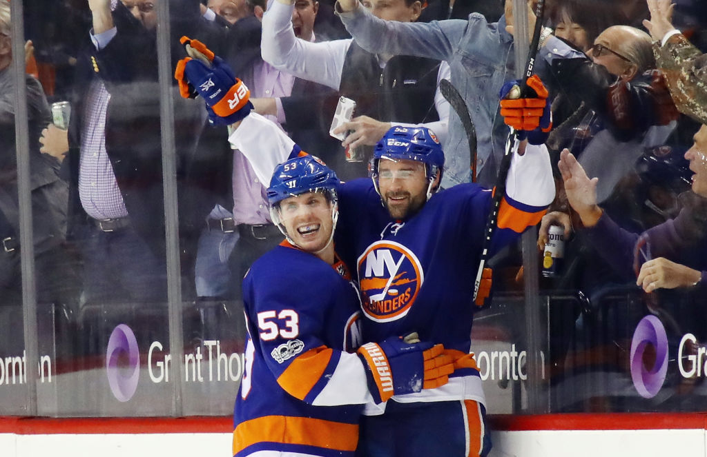 NEW YORK, NY - NOVEMBER 16: Johnny Boychuk #55 of the New York Islanders (r) celebrates his goal at 15:35 of the third period against the Carolina Hurricanes and is joined by Casey Cizikas #53 (l) at the Barclays Center on November 16, 2017 in the Brooklyn borough of New York City. (Photo by Bruce Bennett/Getty Images)