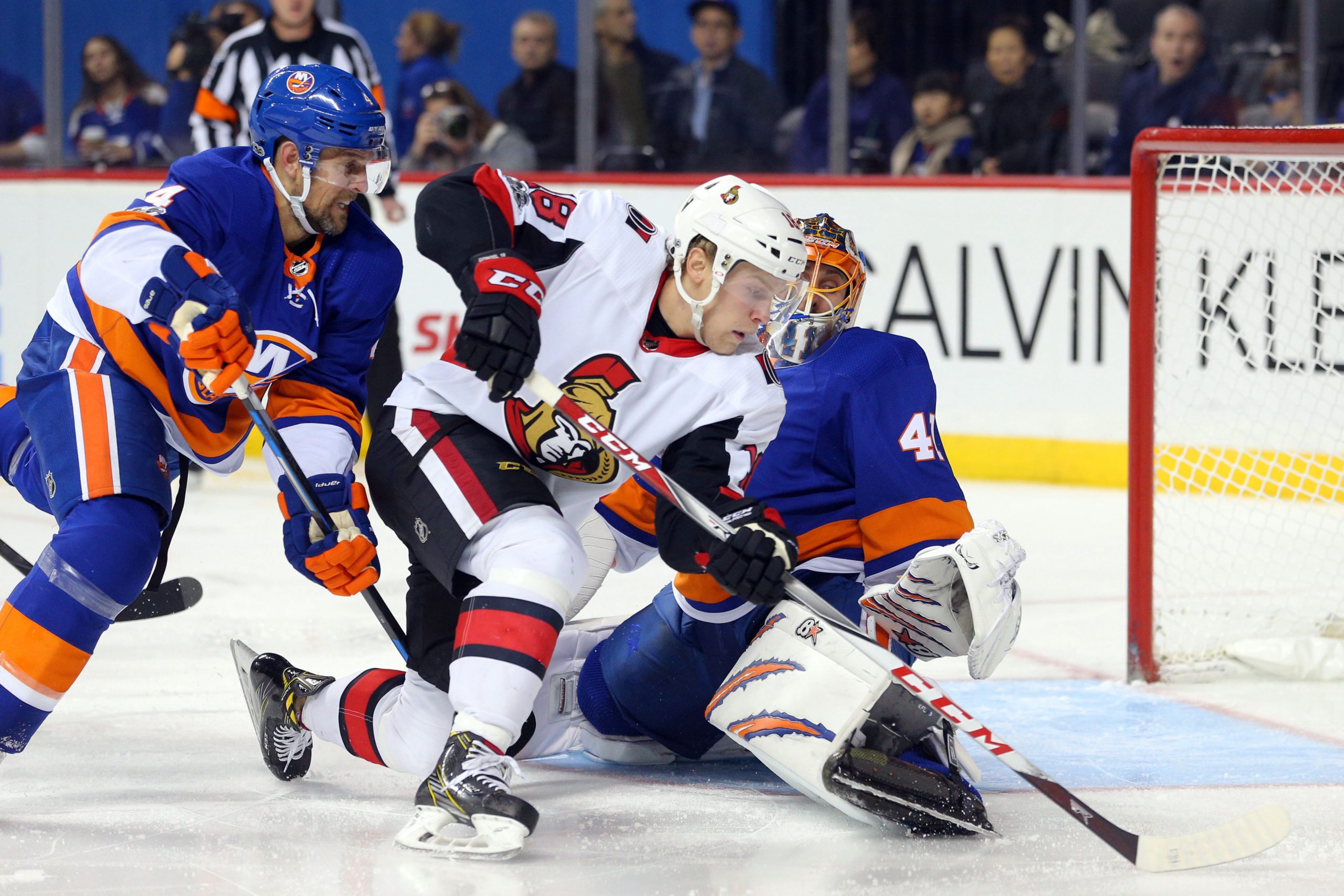 Dec 1, 2017; Brooklyn, NY, USA; Ottawa Senators center Ryan Dzingel (18) scores the game winning goal against New York Islanders goalie Jaroslav Halak (41) in front of Islanders defenseman Dennis Seidenberg (4) during the third period at Barclays Center. Mandatory Credit: Brad Penner-USA TODAY Sports