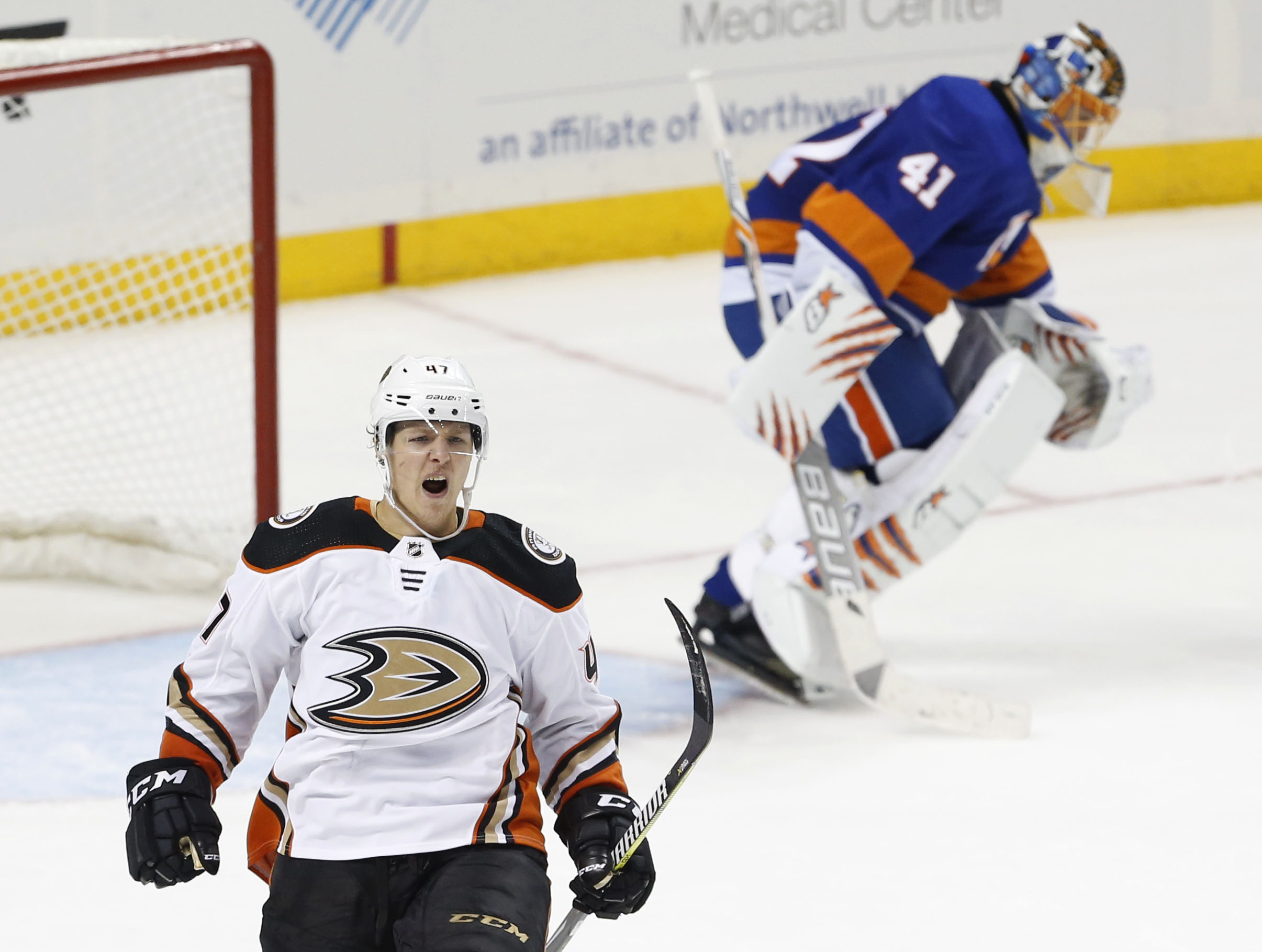 Dec 21, 2017; Brooklyn, NY, USA; Anaheim Ducks defenseman Hampus Lindholm (47) celebrates after scoring the game winning goal against Anaheim Ducks goalie Ryan Miller (30) during third period at Barclays Center. Mandatory Credit: Noah K. Murray-USA TODAY Sports