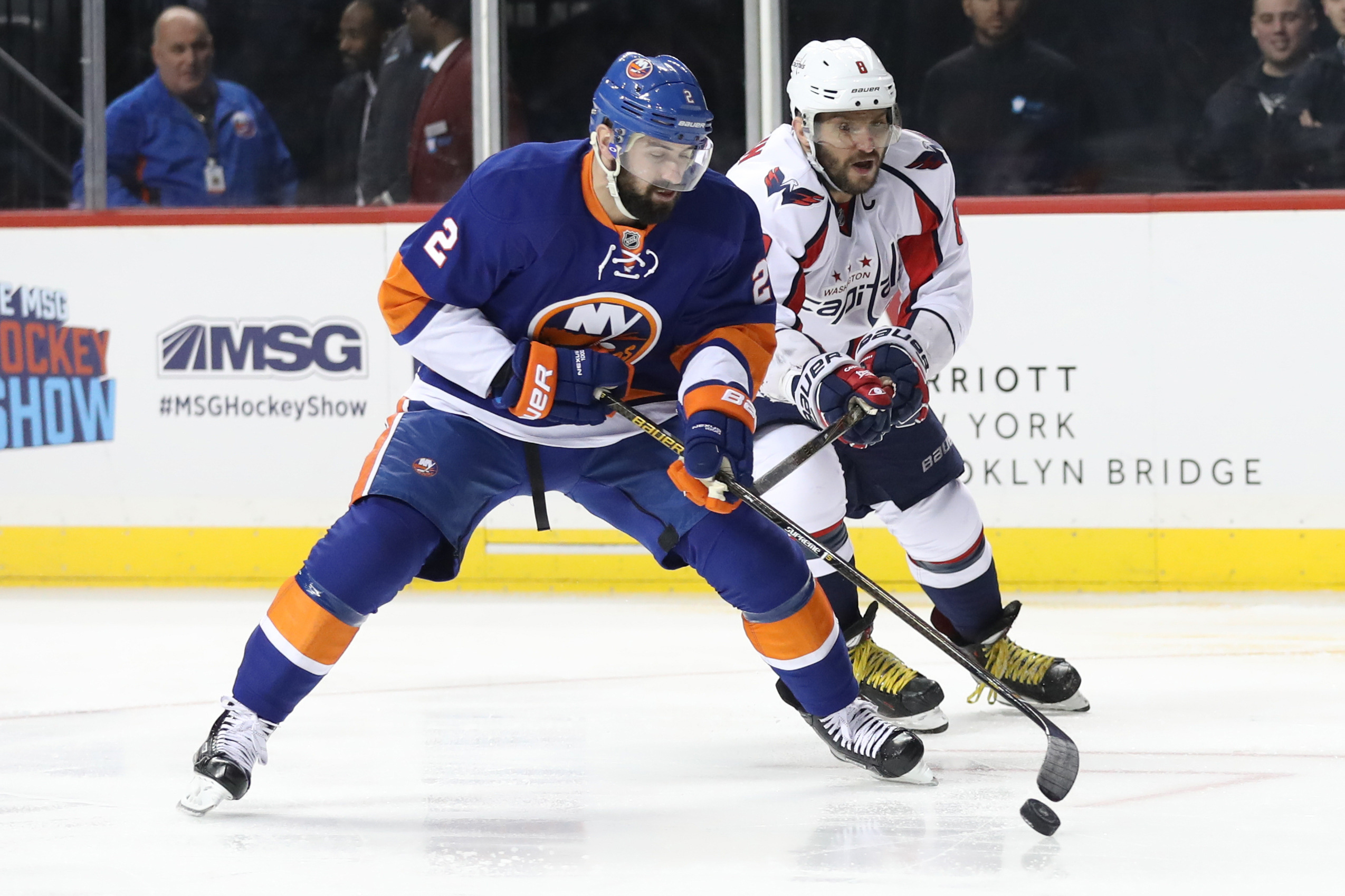 Dec 27, 2016; Brooklyn, NY, USA; New York Islanders defenseman Nick Leddy (2) controls the puck as Washington Capitals left wing Alex Ovechkin (8) gets a stick up during the first period at Barclays Center. Mandatory Credit: Anthony Gruppuso-USA TODAY Sports