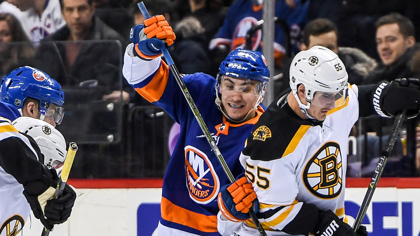 Jan 18, 2018; Brooklyn, NY, USA; New York Islanders left wing Michael Dal Colle (71) and Boston Bruins center Noel Acciari (55) battle for the puck during the second period at Barclays Center. Mandatory Credit: Dennis Schneidler-USA TODAY Sports