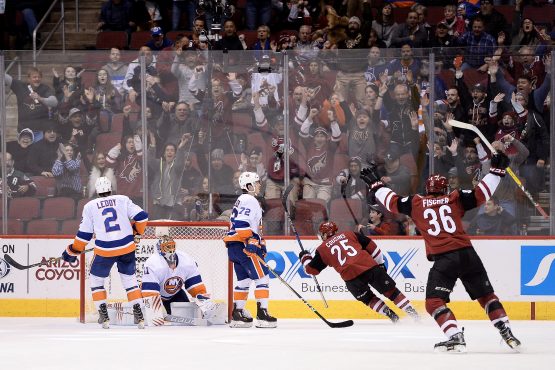 Jan 22, 2018; Glendale, AZ, USA; Arizona Coyotes center Nick Cousins (25) scores the game winning goal against New York Islanders goaltender Jaroslav Halak (41) in overtime at Gila River Arena. The Arizona Coyotes won 3-2 in overtime. Mandatory Credit: Jennifer Stewart-USA TODAY Sports