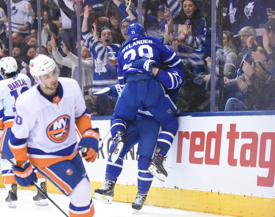 Jan 31, 2018; Toronto, Ontario, CAN; Toronto Maple Leafs forward William Nylander (29) jumps in celebration on defenceman Travis Dermott (23, obscured) after Dermott scored his first career NHL goal against New York Islanders i the second period at Air Canada Centre. Mandatory Credit: Dan Hamilton-USA TODAY Sports