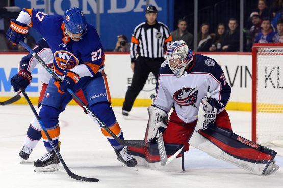 Feb 3, 2018; Brooklyn, NY, USA; Columbus Blue Jackets goalie Joonas Korpisalo (70) makes a save against New York Islanders center Anders Lee (27) during the second period at Barclays Center. Mandatory Credit: Brad Penner-USA TODAY Sports
