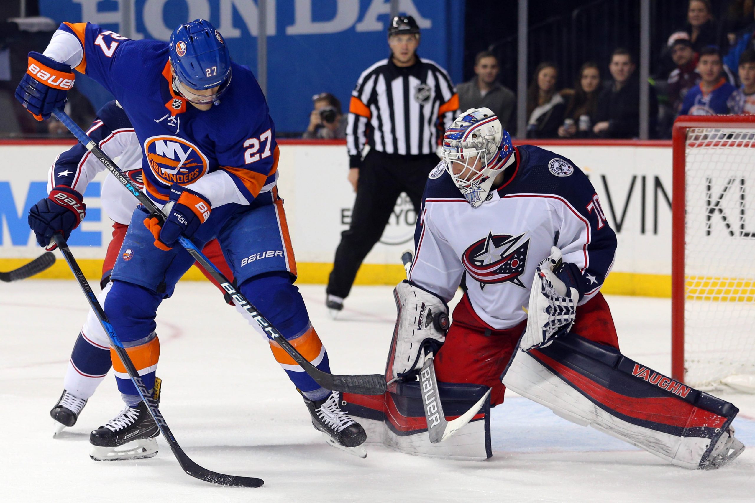Feb 3, 2018; Brooklyn, NY, USA; Columbus Blue Jackets goalie Joonas Korpisalo (70) makes a save against New York Islanders center Anders Lee (27) during the second period at Barclays Center. Mandatory Credit: Brad Penner-USA TODAY Sports