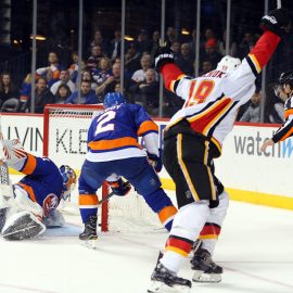 Feb 11, 2018; Brooklyn, NY, USA; Calgary Flames left wing Matthew Tkachuk (19) celebrates his game winning goal against New York Islanders goalie Jaroslav Halak (41) during the third period at Barclays Center. Mandatory Credit: Brad Penner-USA TODAY Sports