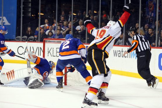Feb 11, 2018; Brooklyn, NY, USA; Calgary Flames left wing Matthew Tkachuk (19) celebrates his game winning goal against New York Islanders goalie Jaroslav Halak (41) during the third period at Barclays Center. Mandatory Credit: Brad Penner-USA TODAY Sports