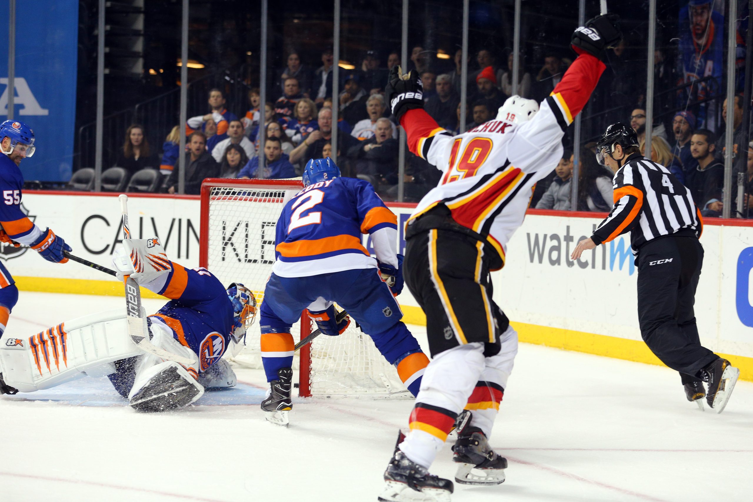 Feb 11, 2018; Brooklyn, NY, USA; Calgary Flames left wing Matthew Tkachuk (19) celebrates his game winning goal against New York Islanders goalie Jaroslav Halak (41) during the third period at Barclays Center. Mandatory Credit: Brad Penner-USA TODAY Sports