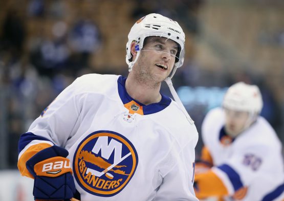 Feb 22, 2018; Toronto, Ontario, CAN; New York Islanders defenseman Thomas Hickey (14) warms up before playing against the Toronto Maple Leafs at Air Canada Centre. Mandatory Credit: Tom Szczerbowski-USA TODAY Sports