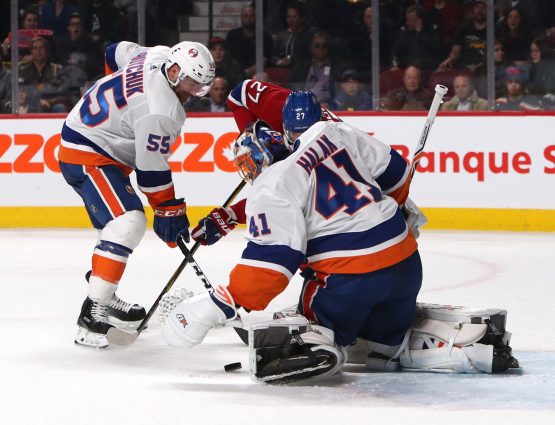 Feb 28, 2018; Montreal, Quebec, CAN; New York Islanders goaltender Jaroslav Halak (41) makes a save against Montreal Canadiens left wing Alex Galchenyuk (27) as defenseman Johnny Boychuk (55) defends during the second period at Bell Centre. Mandatory Credit: Jean-Yves Ahern-USA TODAY Sports