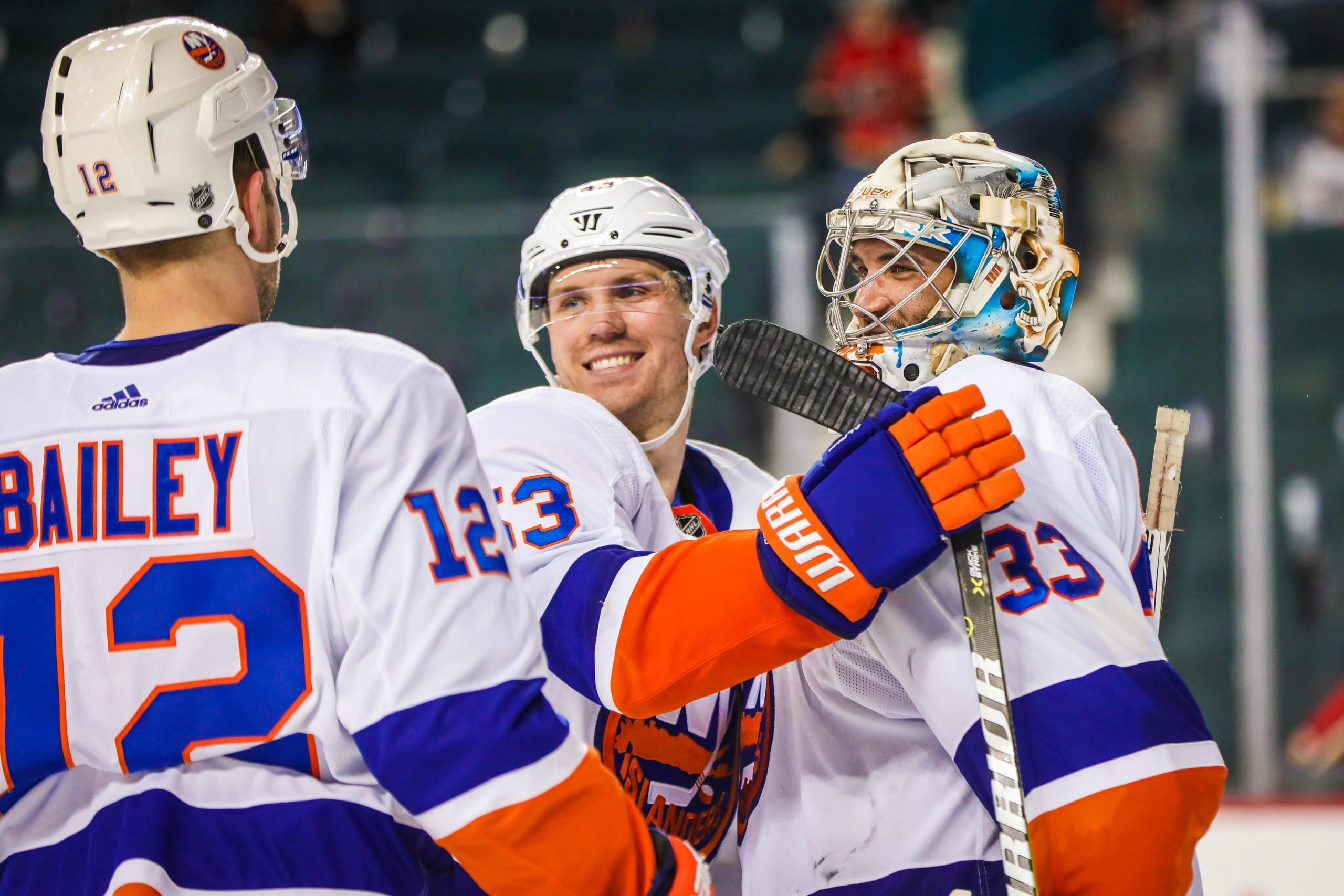 Mar 11, 2018; Calgary, Alberta, CAN; New York Islanders goaltender Christopher Gibson (33) celebrate with teammates after defeating the Calgary Flames at Scotiabank Saddledome. Mandatory Credit: Sergei Belski-USA TODAY Sports