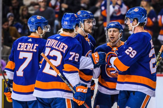 Mar 22, 2018; Brooklyn, NY, USA; New York Islanders left wing Anders Lee (27) celebrates with teammates after scoring a goal against the Tampa Bay Lightning during the second period at Barclays Center. Mandatory Credit: Dennis Schneidler-USA TODAY Sports