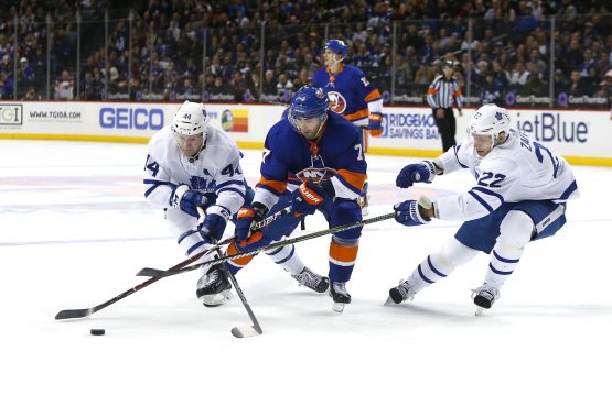 Mar 30, 2018; Brooklyn, NY, USA; Toronto Maple Leafs defenseman Morgan Rielly (44) and defenseman Nikita Zaitsev (22) pressure New York Islanders center Jordan Eberle (7) during second period at Barclays Center. Mandatory Credit: Noah K. Murray-USA TODAY Sports