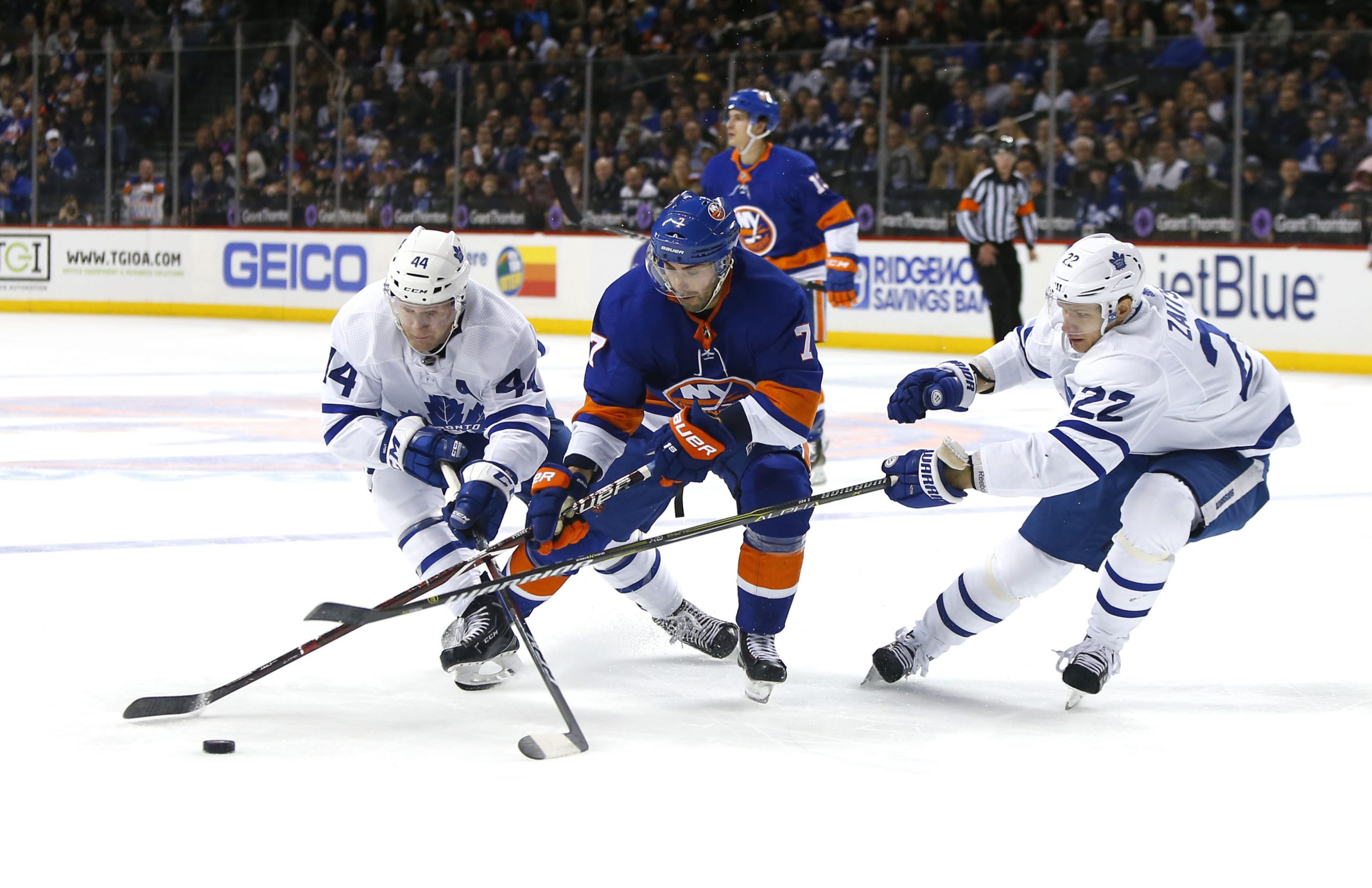 Mar 30, 2018; Brooklyn, NY, USA; Toronto Maple Leafs defenseman Morgan Rielly (44) and defenseman Nikita Zaitsev (22) pressure New York Islanders center Jordan Eberle (7) during second period at Barclays Center. Mandatory Credit: Noah K. Murray-USA TODAY Sports