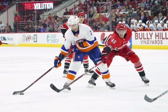 Feb 16, 2018; Raleigh, NC, USA; New York Islanders forward Jordan Eberle (7) skates with the puck against Carolina Hurricanes forward Victor Rask (49) at PNC Arena. The New York Islanders defeated the Carolina Hurricanes 3-0. Mandatory Credit: James Guillory-USA TODAY Sports