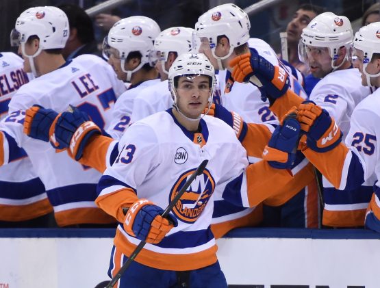 Dec 29, 2018; Toronto, Ontario, CAN; New York Islanders forward Mathew Barzal (13) celebrates a goal against Toronto Maple Leafs in the second period at Scotiabank Arena. Mandatory Credit: Dan Hamilton-USA TODAY Sports