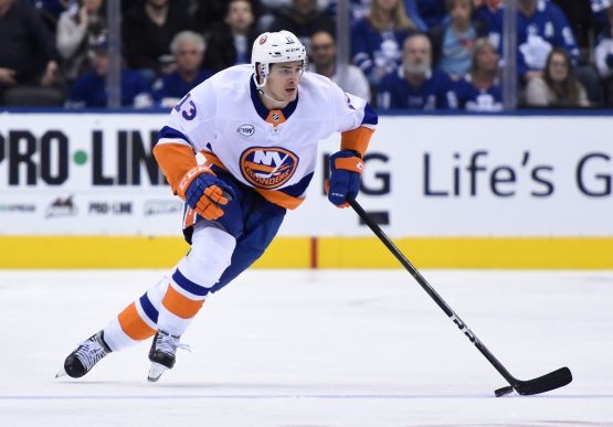 Dec 29, 2018; Toronto, Ontario, CAN; New York Islanders forward Mathew Barzal (13) skates the puck up ice against Toronto Maple Leafs in the third period at Scotiabank Arena. Barzal scored a natural hat trick in a 4-0 win for the Islanders. Mandatory Credit: Dan Hamilton-USA TODAY Sports