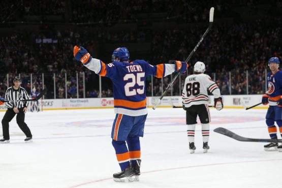 Jan 3, 2019; Uniondale, NY, USA; New York Islanders defenseman Devon Toews (25) celebrates his game winning goal against the Chicago Blackhawks during overtime at Nassau Veterans Memorial Coliseum. Mandatory Credit: Brad Penner-USA TODAY Sports