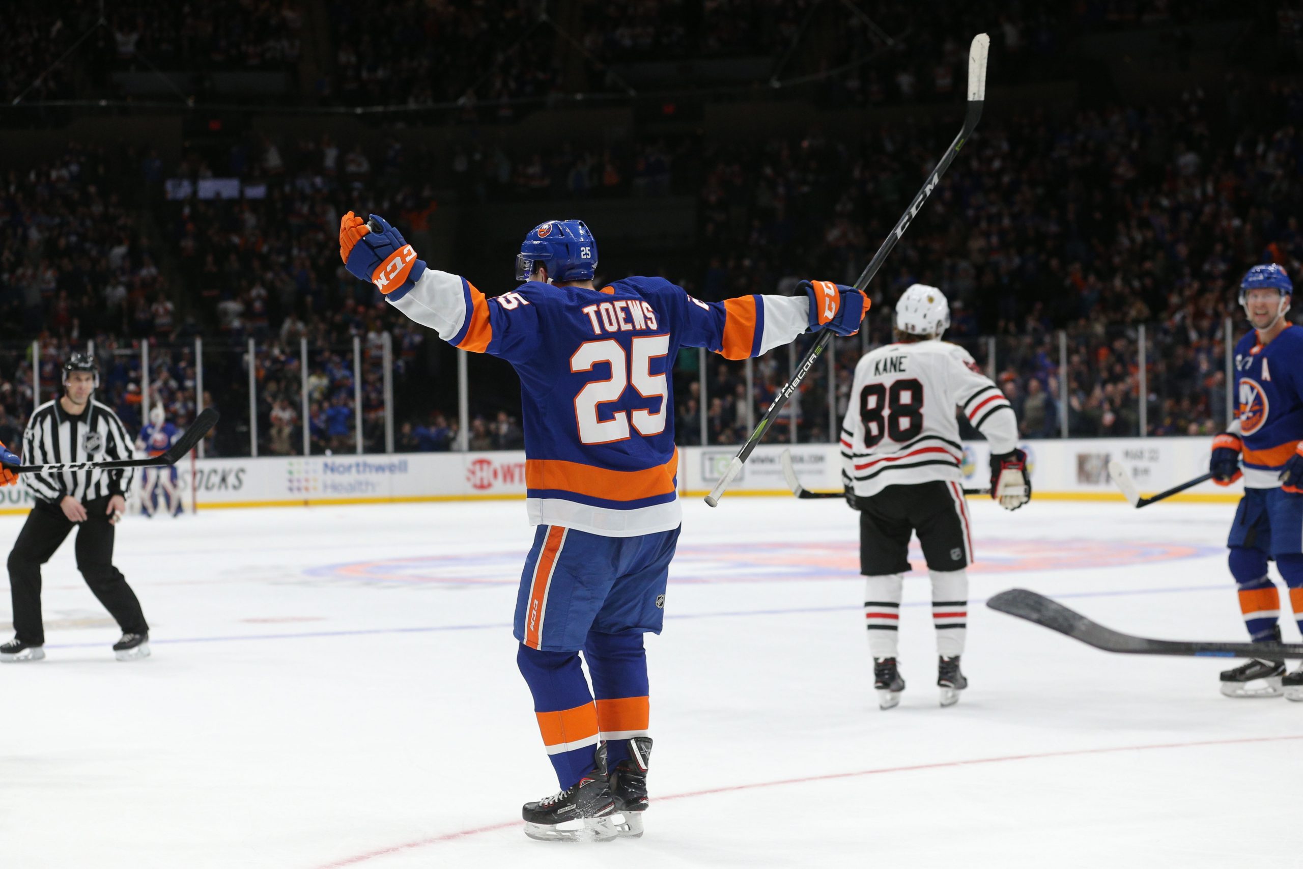 Jan 3, 2019; Uniondale, NY, USA; New York Islanders defenseman Devon Toews (25) celebrates his game winning goal against the Chicago Blackhawks during overtime at Nassau Veterans Memorial Coliseum. Mandatory Credit: Brad Penner-USA TODAY Sports