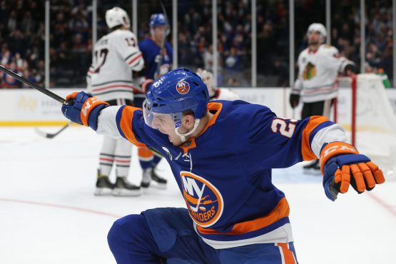 Jan 3, 2019; Uniondale, NY, USA; New York Islanders defenseman Devon Toews (25) celebrates his game winning goal against the Chicago Blackhawks during overtime at Nassau Veterans Memorial Coliseum. Mandatory Credit: Brad Penner-USA TODAY Sports
