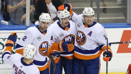 Nov 10, 2018; Sunrise, FL, USA; New York Islanders center Mathew Barzal (13) celebrates his goal against the Florida Panthers with left wing Josh Bailey (12) and defenseman Nick Leddy (2) in the first period at BB&T Center. Mandatory Credit: Robert Mayer-USA TODAY Sports
