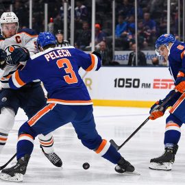 Oct 8, 2019; Uniondale, NY, USA; New York Islanders defenseman Adam Pelech (3) pushes Edmonton Oilers center Connor McDavid (97) off the puck during the third period at Nassau Veterans Memorial Coliseum. Mandatory Credit: Dennis Schneidler-USA TODAY Sports