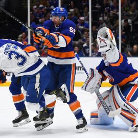 Nov 1, 2019; Uniondale, NY, USA; New York Islanders goaltender Thomas Greiss (1) makes a glove save behind New York Islanders defenseman Johnny Boychuk (55) and Tampa Bay Lightning center Yanni Gourde (37) during the first period at Nassau Veterans Memorial Coliseum. Mandatory Credit: Dennis Schneidler-USA TODAY Sports