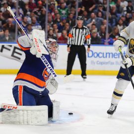 Nov 2, 2019; Buffalo, NY, USA; Buffalo Sabres left wing Johan Larsson (22) deflects a shot on New York Islanders goaltender Semyon Varlamov (40) during the second period at KeyBank Center. Mandatory Credit: Timothy T. Ludwig-USA TODAY Sports