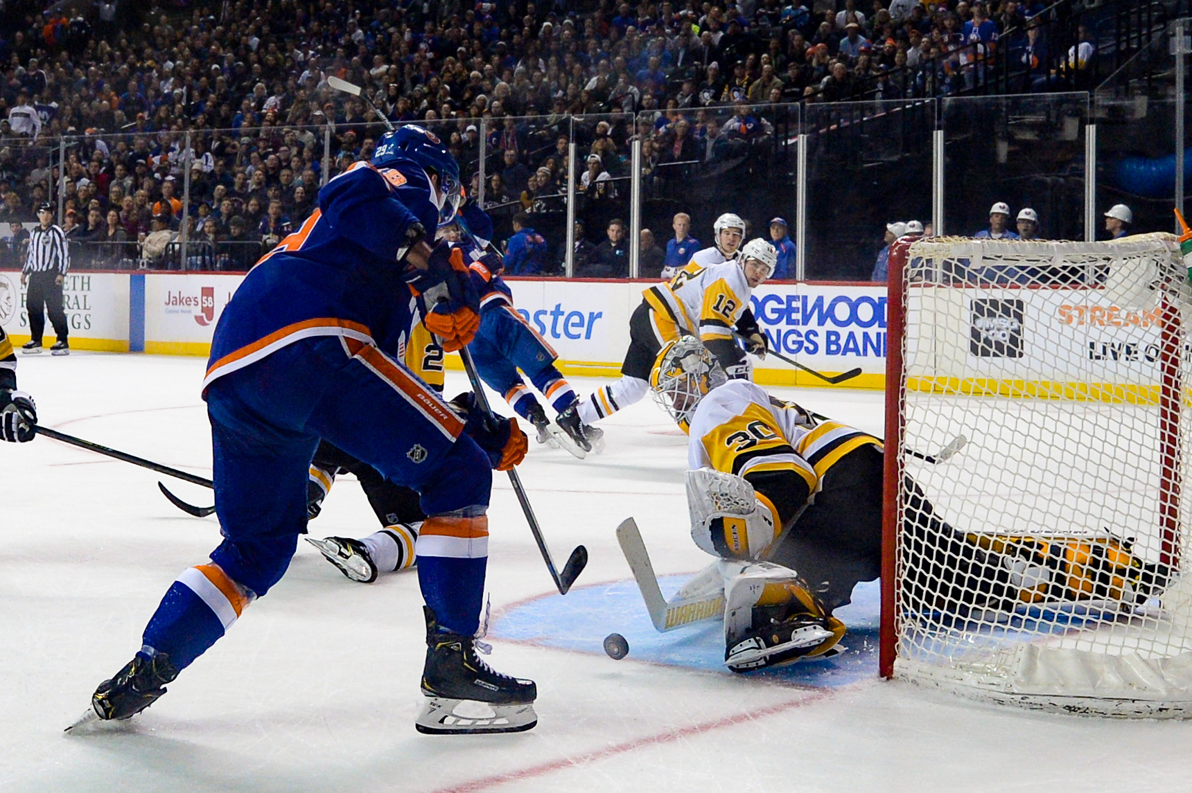 Nov 7, 2019; Brooklyn, NY, USA; Pittsburgh Penguins goaltender Matt Murray (30) makes a save against New York Islanders center Brock Nelson (29) during the second period at Barclays Center. Mandatory Credit: Dennis Schneidler-USA TODAY Sports