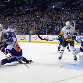 Nov 7, 2019; Brooklyn, NY, USA; Pittsburgh Penguins center Evgeni Malkin (71) scores a goal against New York Islanders defenseman Johnny Boychuk (55) during the third period at Barclays Center. Mandatory Credit: Dennis Schneidler-USA TODAY Sports