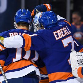 Nov 9, 2019; Brooklyn, NY, USA; New York Islanders center Jordan Eberle (7) and center Derick Brassard (10) congratulate goaltender Thomas Greiss (1) after a 2-1 victory over the Florida Panthers at Barclays Center. Mandatory Credit: Dennis Schneidler-USA TODAY Sports
