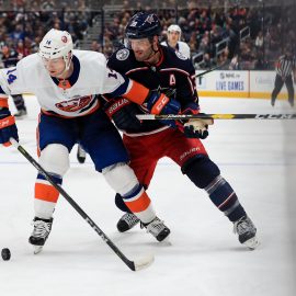 Oct 19, 2019; Columbus, OH, USA; New York Islanders right wing Tom Kuhnhackl (14) skates against Columbus Blue Jackets center Boone Jenner (38) in the second period at Nationwide Arena. Mandatory Credit: Aaron Doster-USA TODAY Sports