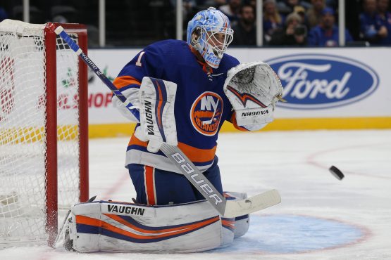 Dec 17, 2019; Uniondale, NY, USA; New York Islanders goalie Thomas Greiss (1) plays the puck against the Nashville Predators during the first period at Nassau Veterans Memorial Coliseum. Mandatory Credit: Brad Penner-USA TODAY Sports