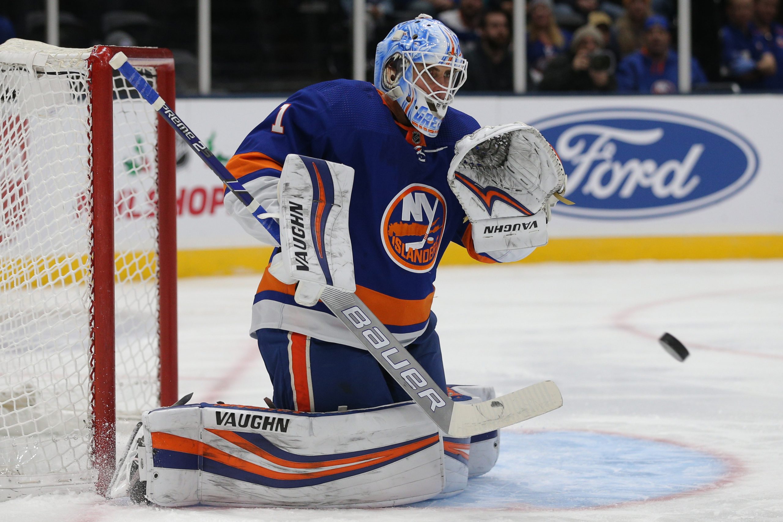 Dec 17, 2019; Uniondale, NY, USA; New York Islanders goalie Thomas Greiss (1) plays the puck against the Nashville Predators during the first period at Nassau Veterans Memorial Coliseum. Mandatory Credit: Brad Penner-USA TODAY Sports
