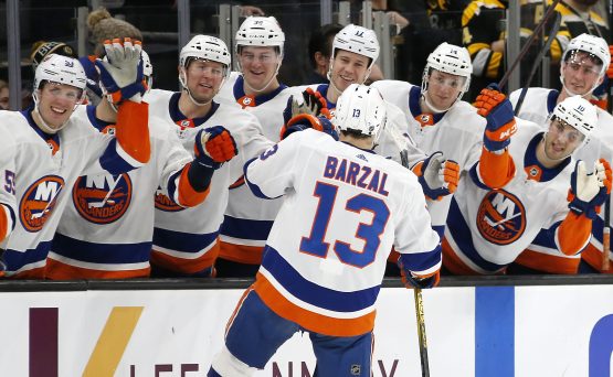 Dec 19, 2019; Boston, MA, USA; New York Islanders center Mathew Barzal (13) celebrates with teammates after scoring a goal against the Boston Bruins during a shootout at TD Garden. Mandatory Credit: Winslow Townson-USA TODAY Sports