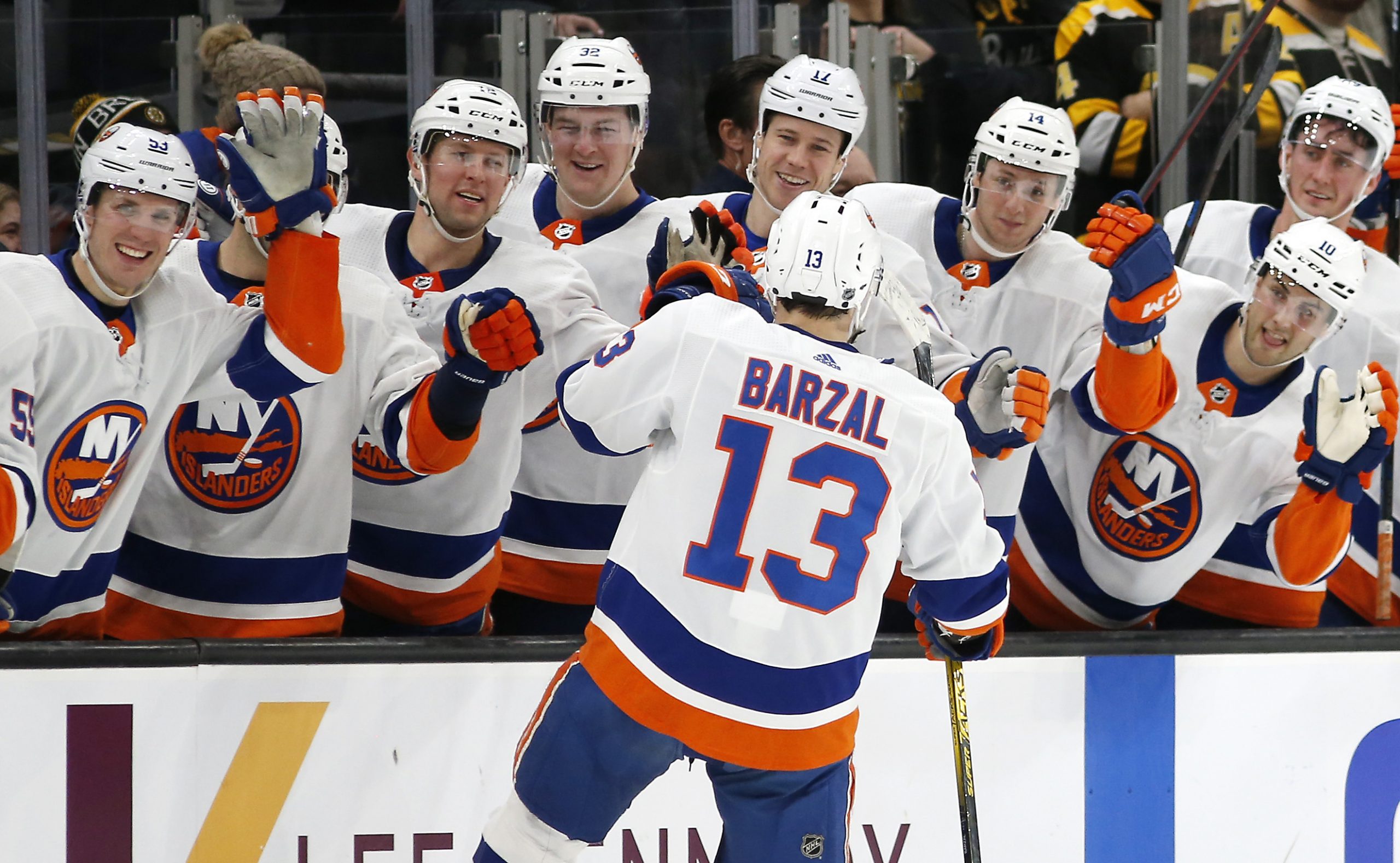 Dec 19, 2019; Boston, MA, USA; New York Islanders center Mathew Barzal (13) celebrates with teammates after scoring a goal against the Boston Bruins during a shootout at TD Garden. Mandatory Credit: Winslow Townson-USA TODAY Sports