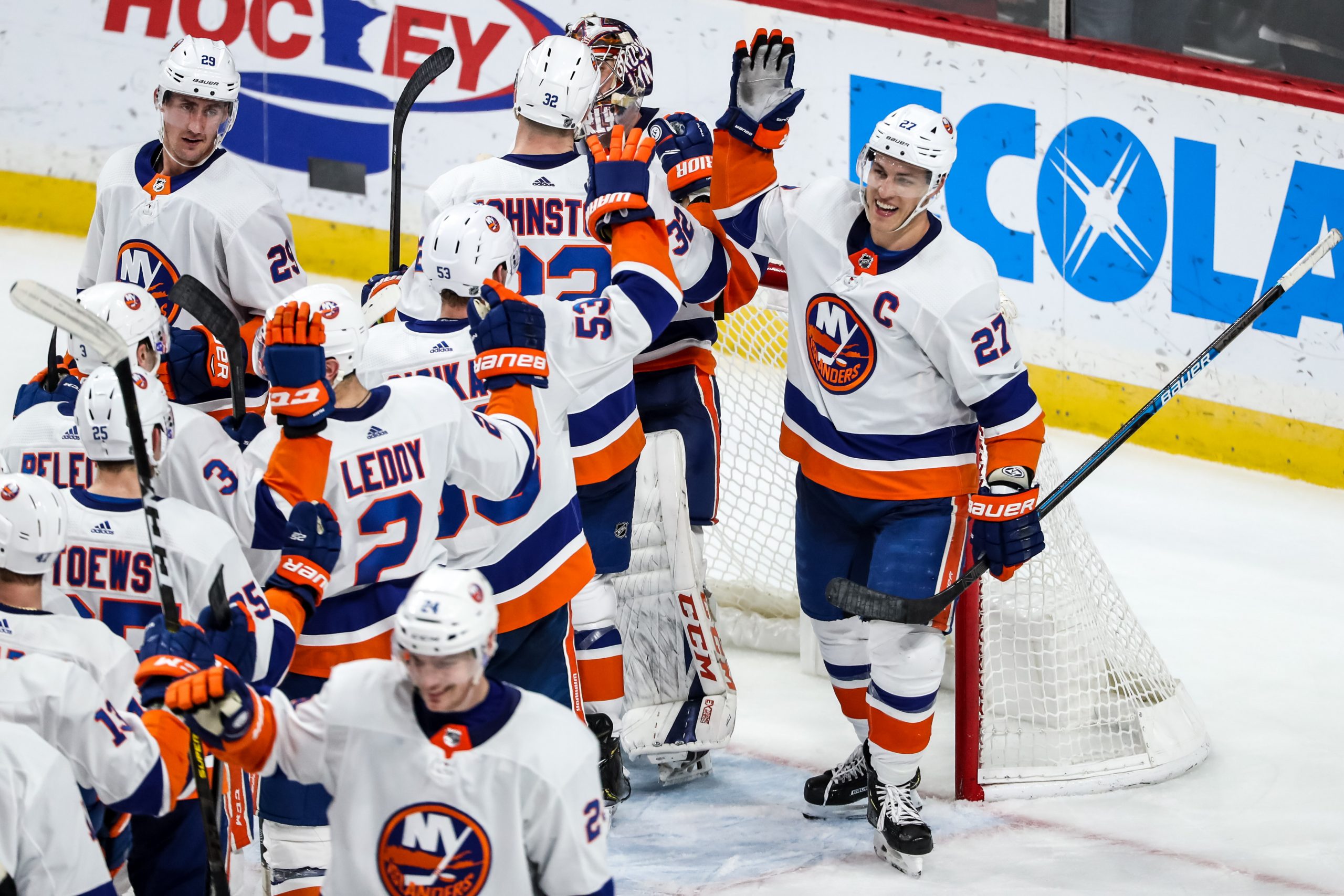 Dec 29, 2019; Saint Paul, Minnesota, USA; New York Islanders forward Anders Lee (27) celebrates with teammates following the game against the Minnesota Wild at Xcel Energy Center. Mandatory Credit: Brace Hemmelgarn-USA TODAY Sports